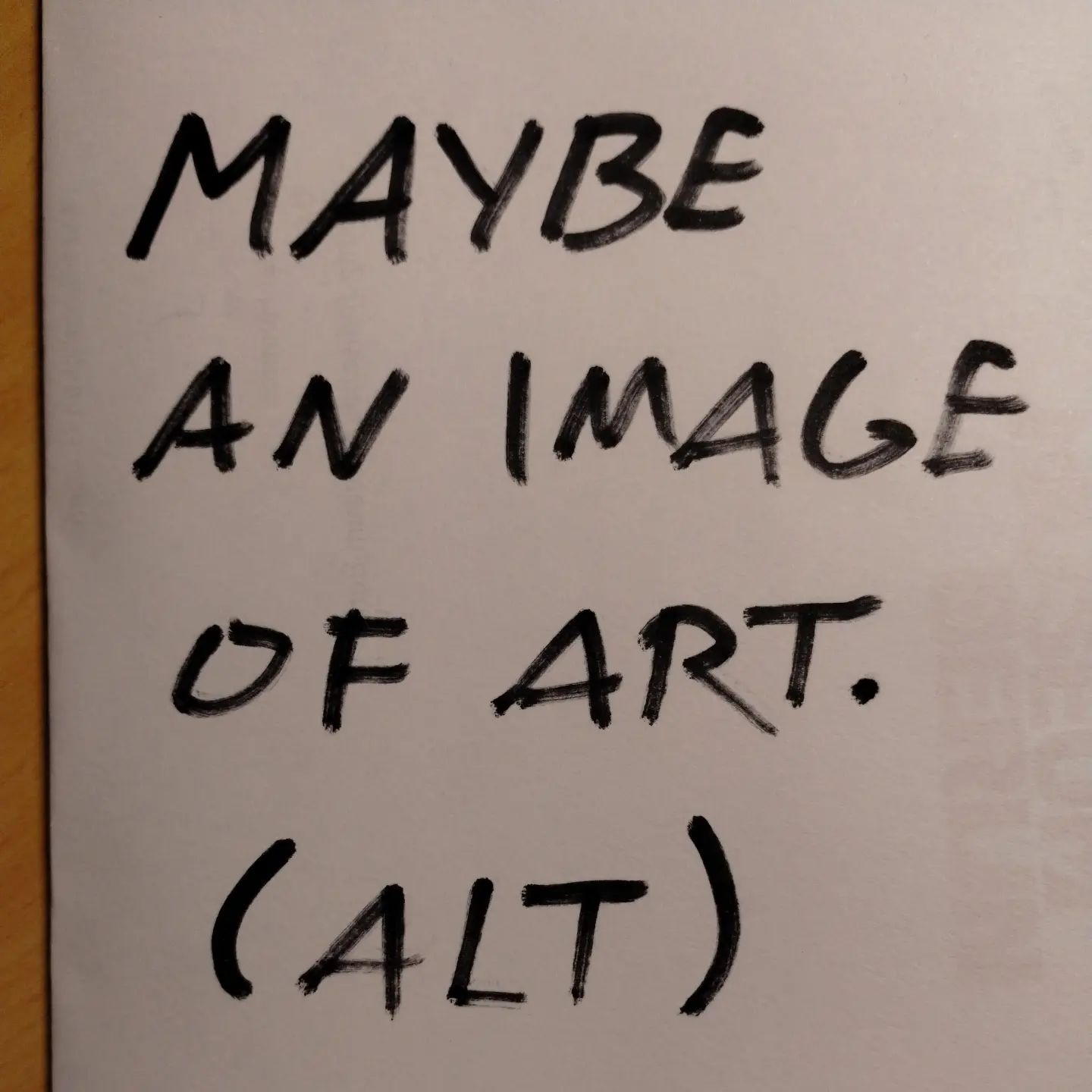 Photo of handwritten text on paper:	Maybe an image of art.	(ALT)