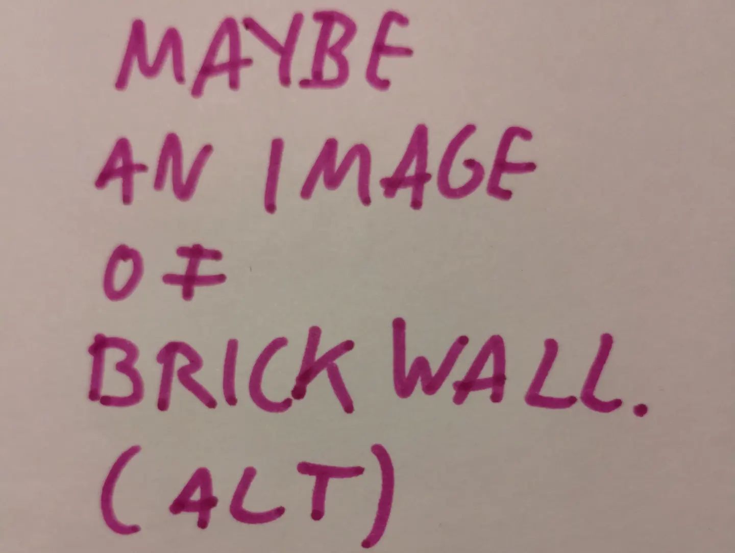 Photo of handwritten text on paper:	Maybe an image of brick wall.	(ALT)