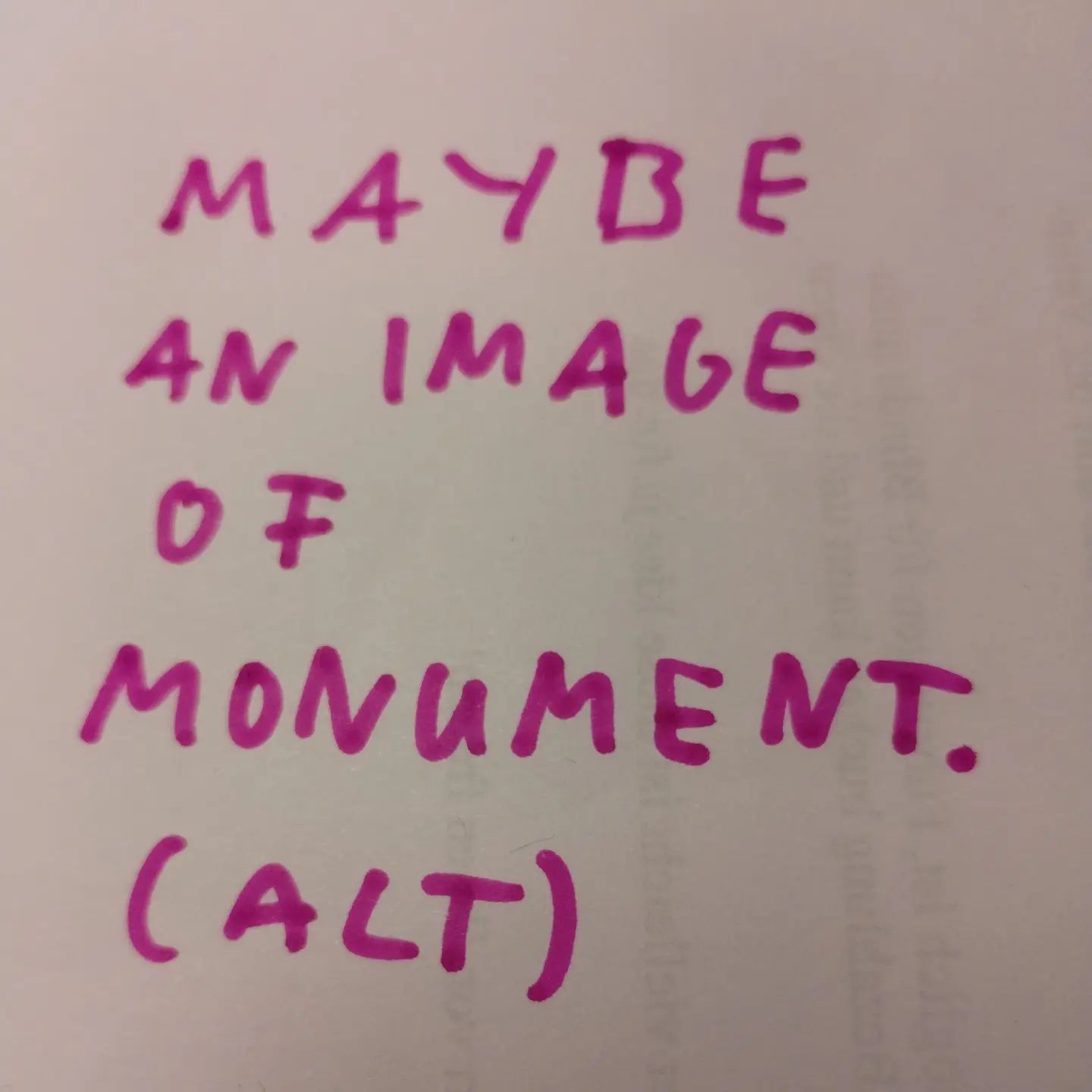 Photo of handwritten text on paper:	Maybe an image of monument.	(ALT)